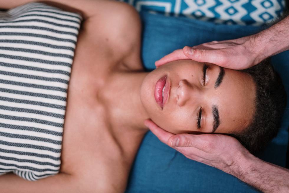 a person lying down and having a massage