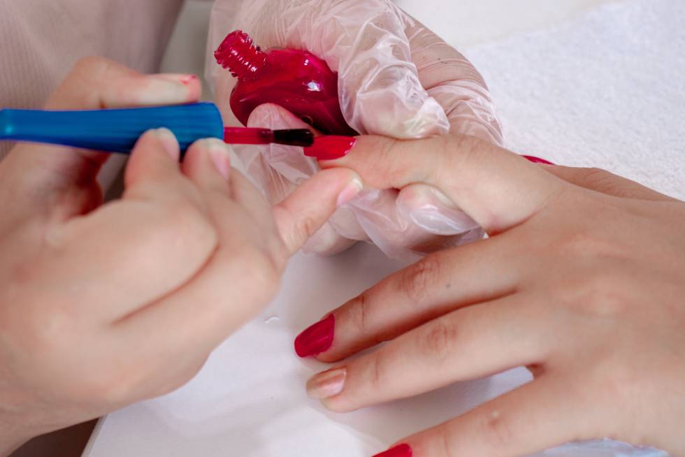 a person painting their nails